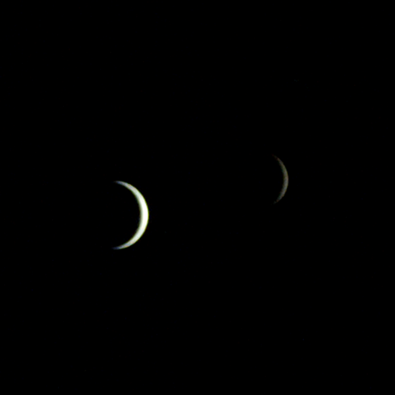 A black background with a thin white crescent on the left representing the Earth, and a thin off-white crescent on the right represents the Moon.